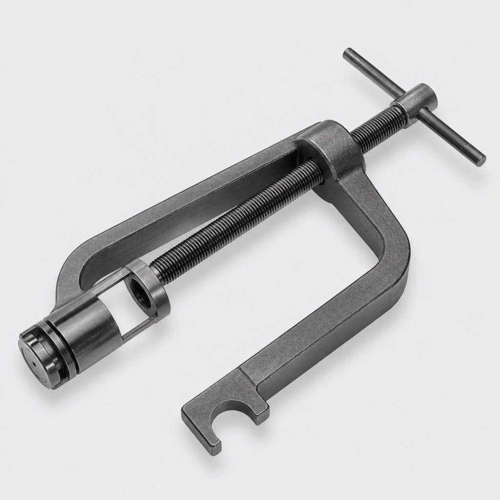 Outil de compression de ressort de soupape présenté sur fond clair